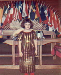 Marsha in front of flags